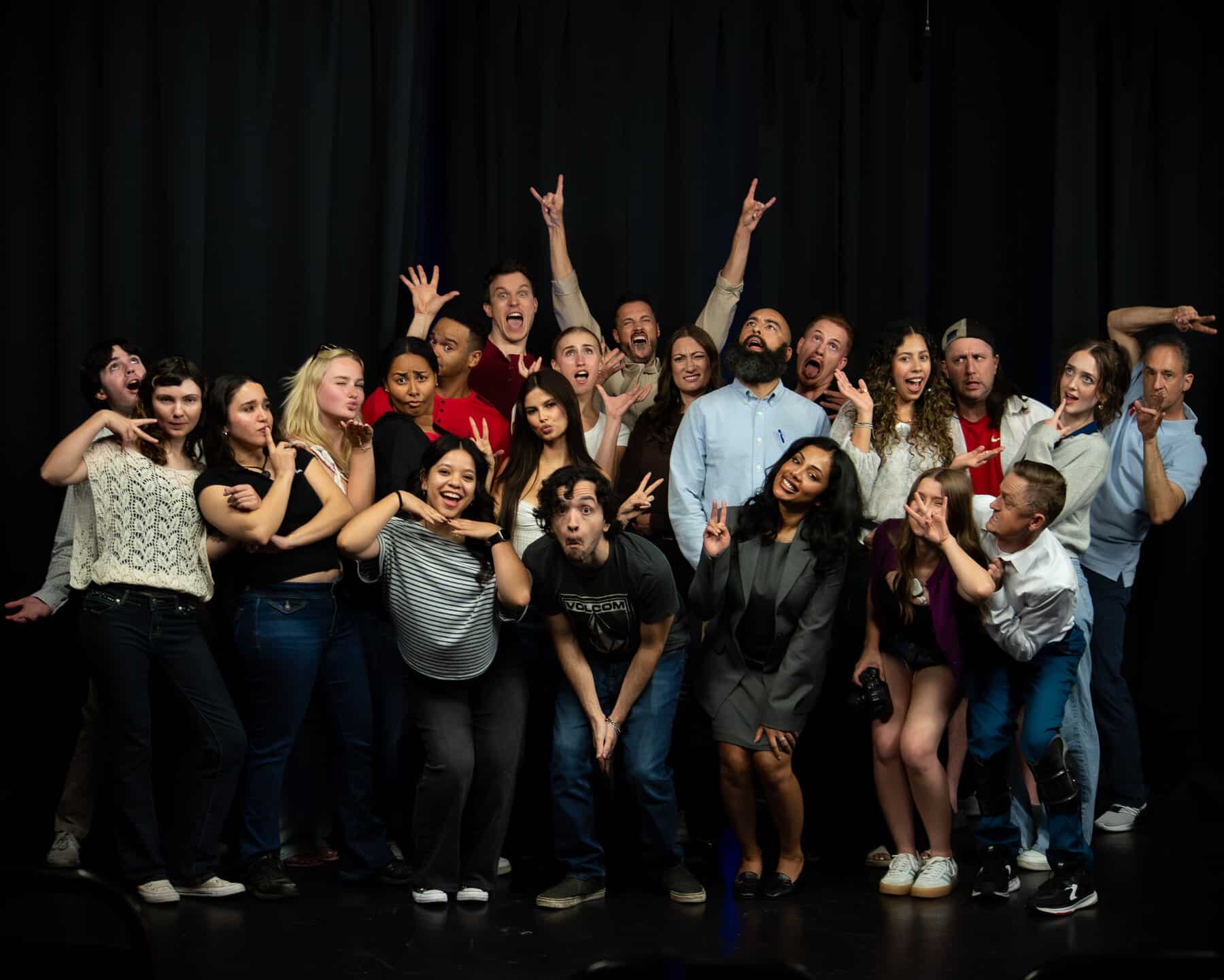 A full room of adult students on stage together at Dearing Acting Studio in Phoenix