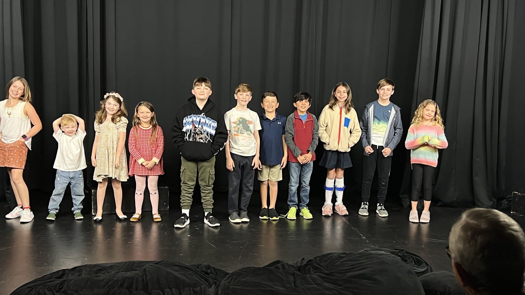 The Wednesday kid improv class lined up on stage at Dearing Acting Studio in Phoenix