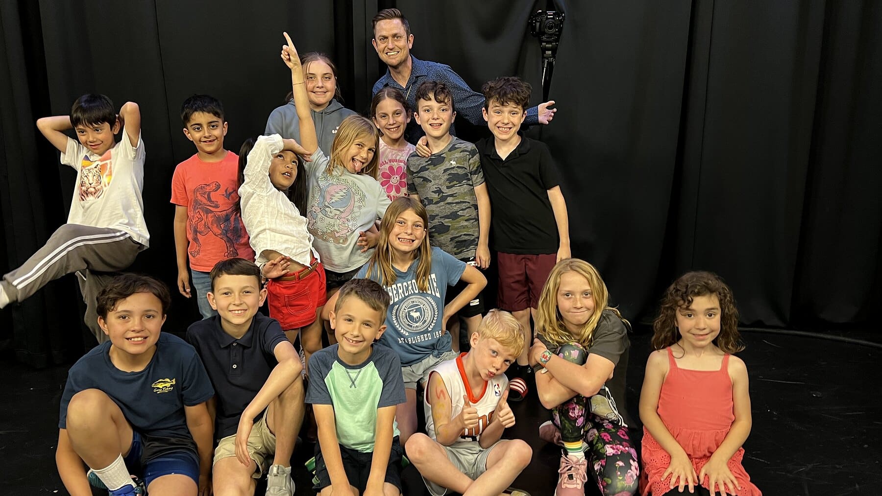 Brian Sweeney and the Wednesday kid improv class piled together on stage at Dearing Acting Studio in Phoenix