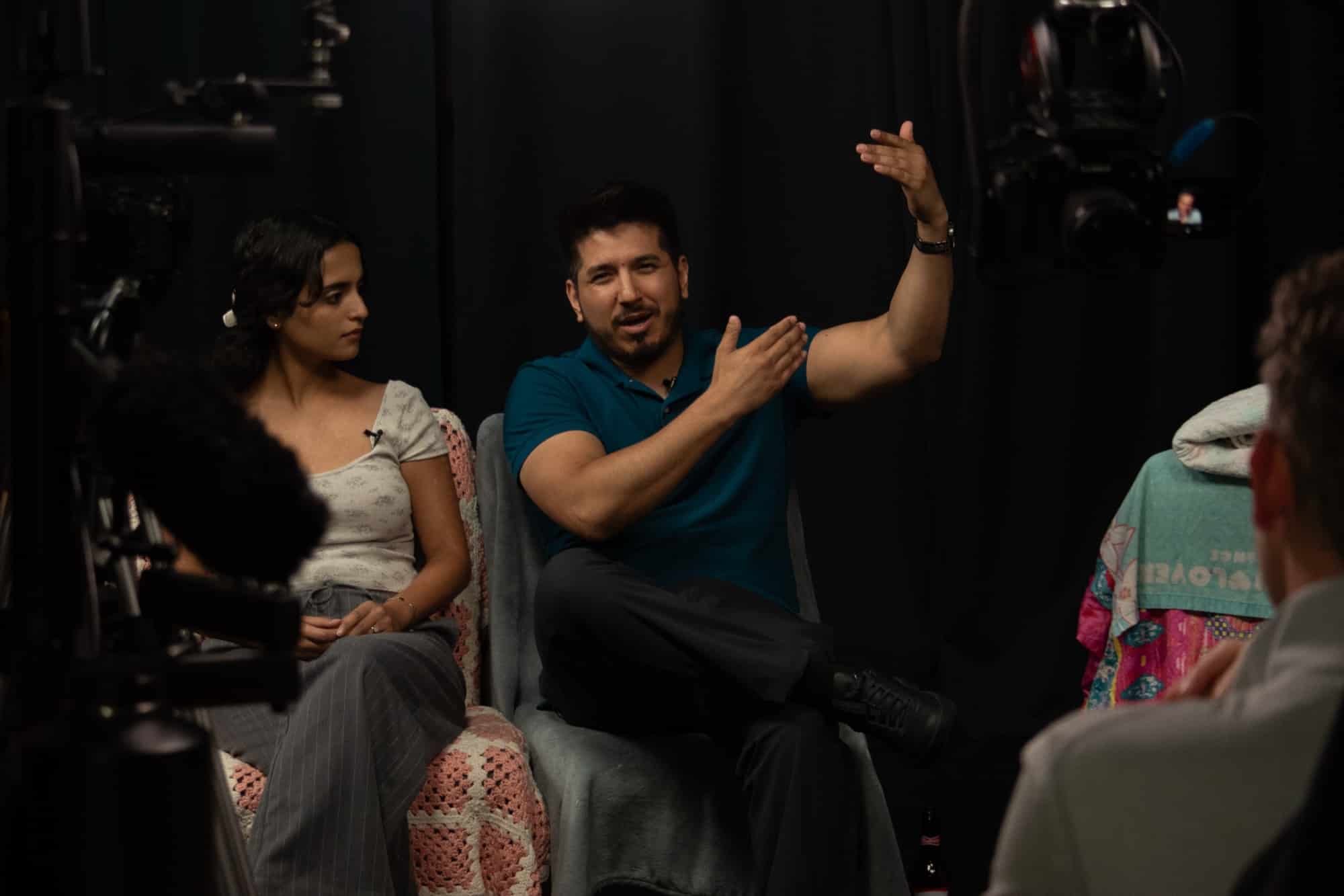 Two Masterclass actors mid-scene on the couch at Dearing Acting Studio